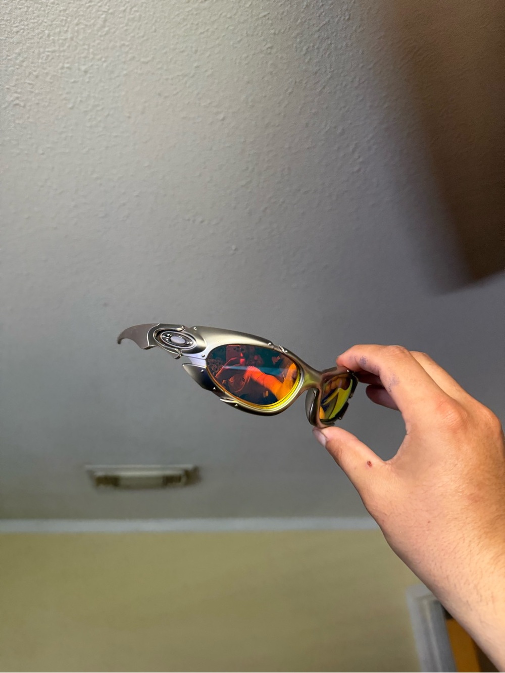 Oakley Men’s Silver Frame Sunglasses with Red-Orange Mirrored Lenses